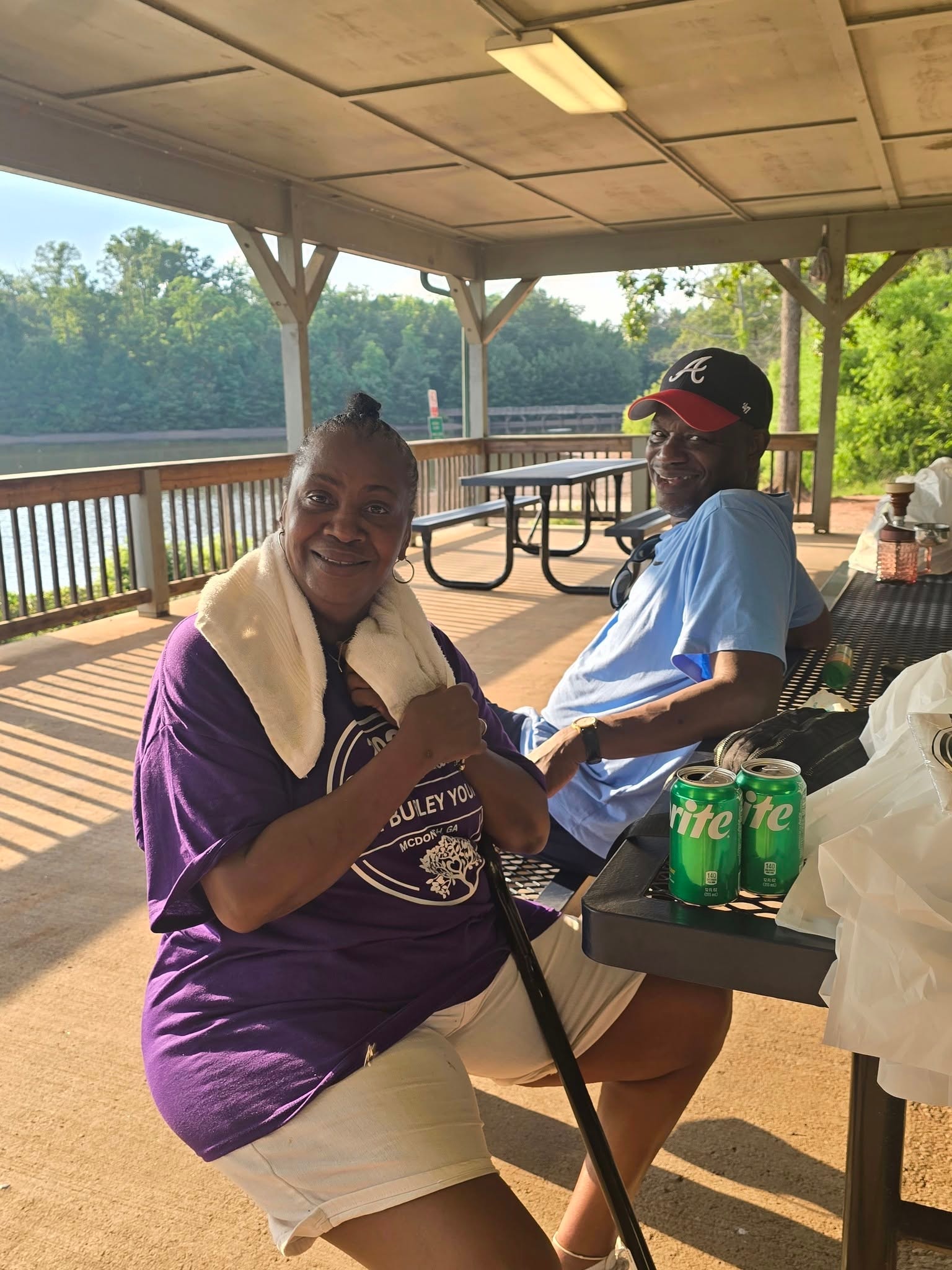 Two family members relaxing at pavilion picnic table