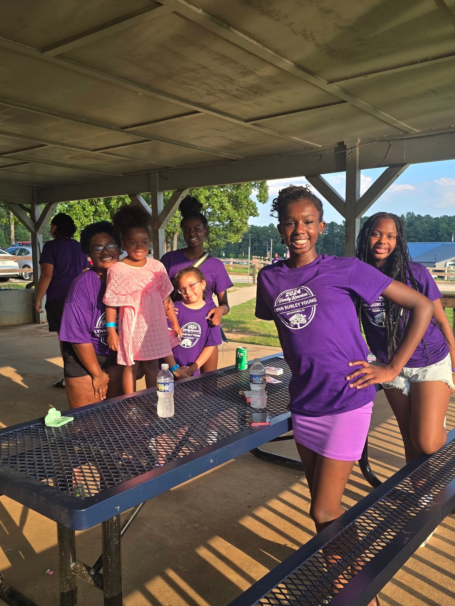 Kids and teens in purple reunion shirts at pavilion